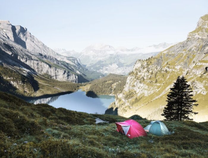 Two tents base camping in a mountainous valley. Vaia Magazine