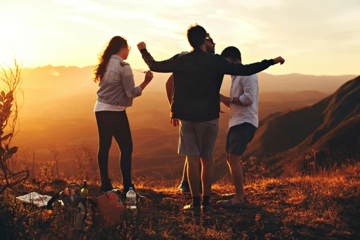 GCSE Results Day 2024, A Group of students hanging out in the sunset, StudySmarter Magazine